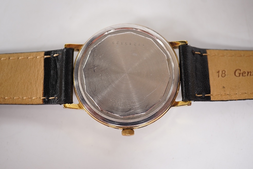 A gentleman's steel and gold plated Longines Conquest manual wind wrist watch, with baton numerals and date aperture, case diameter 35mm, together with a gentleman's stainless steel Marvin manual wind wrist watch, case d